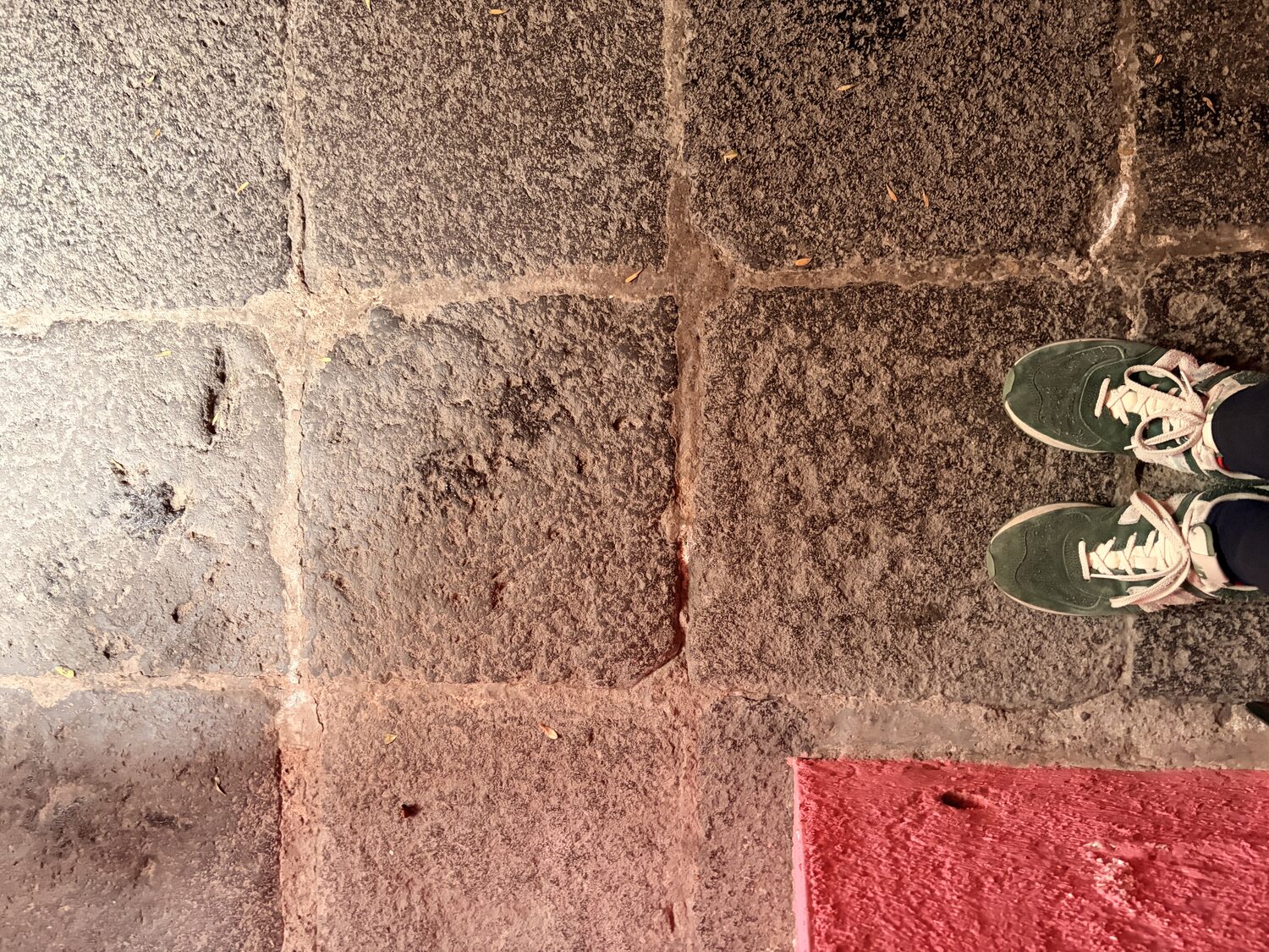 My feet on the raw lava floor, a line of red at the edge.